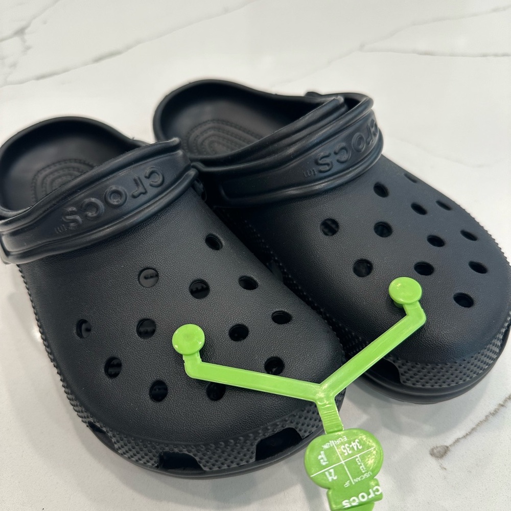 Brand new, never worn Crocs. Big Kids size J3